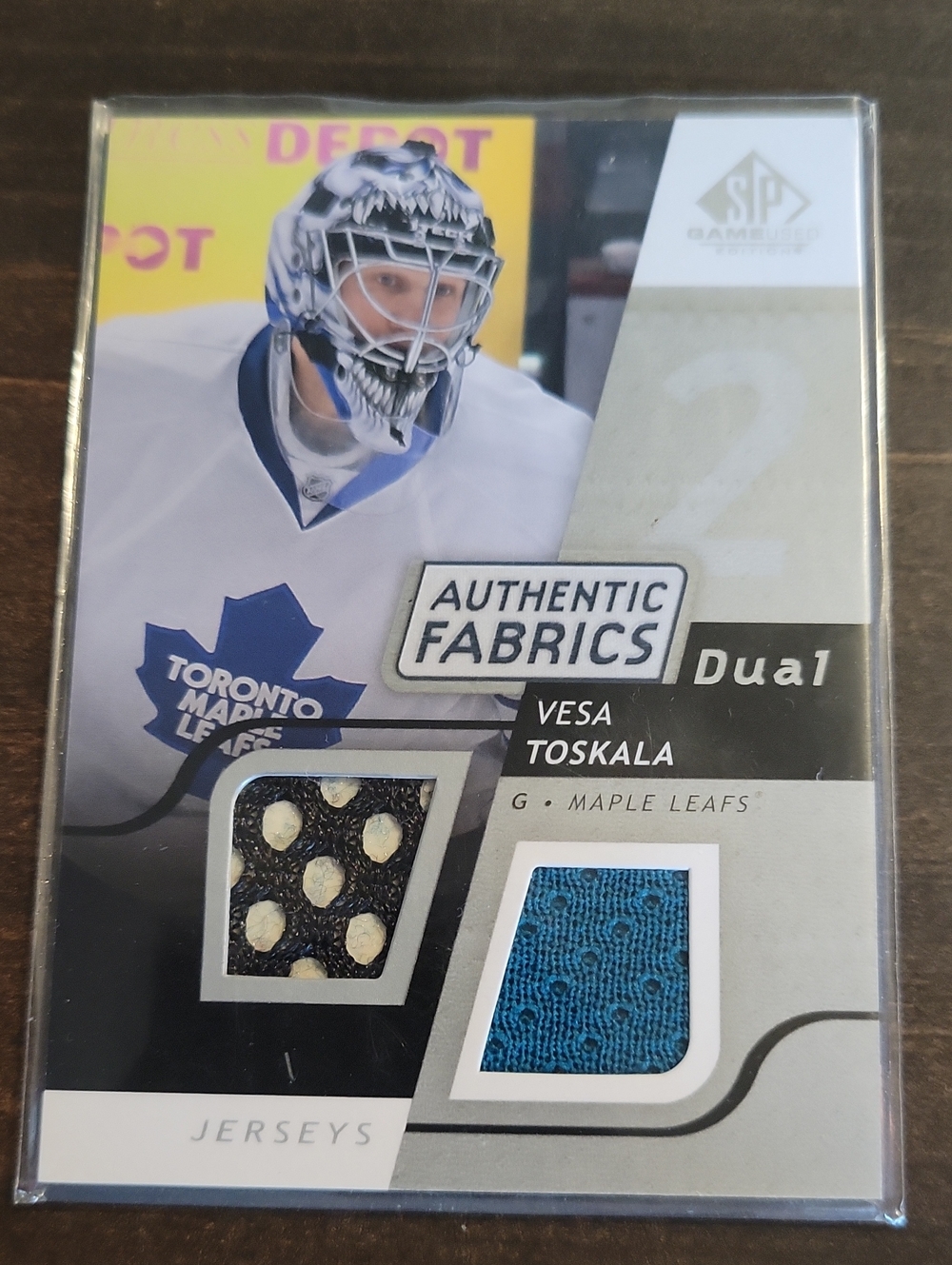 2008/09 Authentic Vesa Toskala Fabrics Dual Jersey Trading Card - Blue/Black -